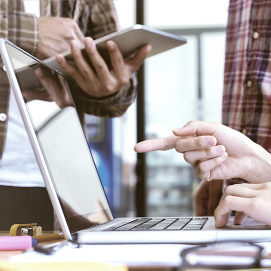people working in front of a laptop 