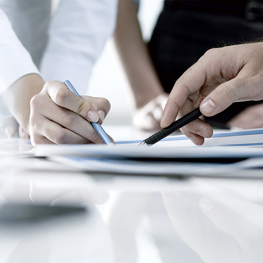 people pointing papers