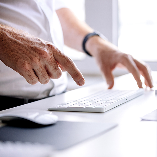 man typing in a keyboard