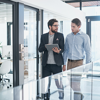 people looking into a tablet