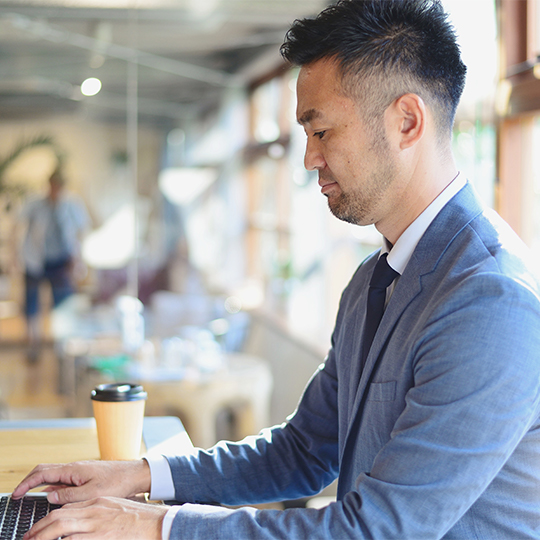 man looking into a tablet
