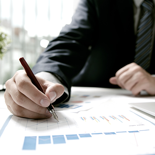 man looking into some graphics