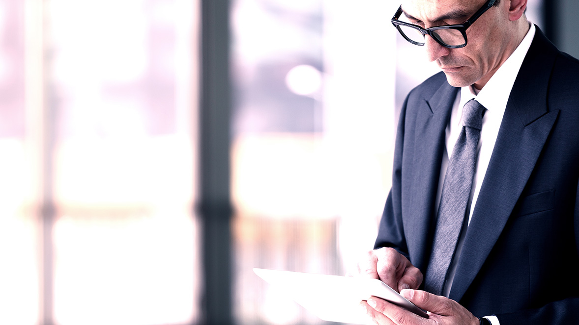 man looking at document