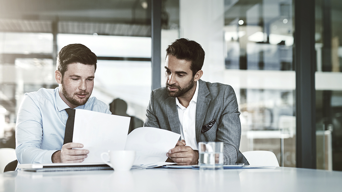 men looking to papers